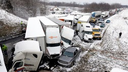 A more than -vehicle pileup on a snowy Indiana interstate left at least  people injured Thursday, including at least one critically, and shut down a heavily traveled highway for most of the evening, authorities said.